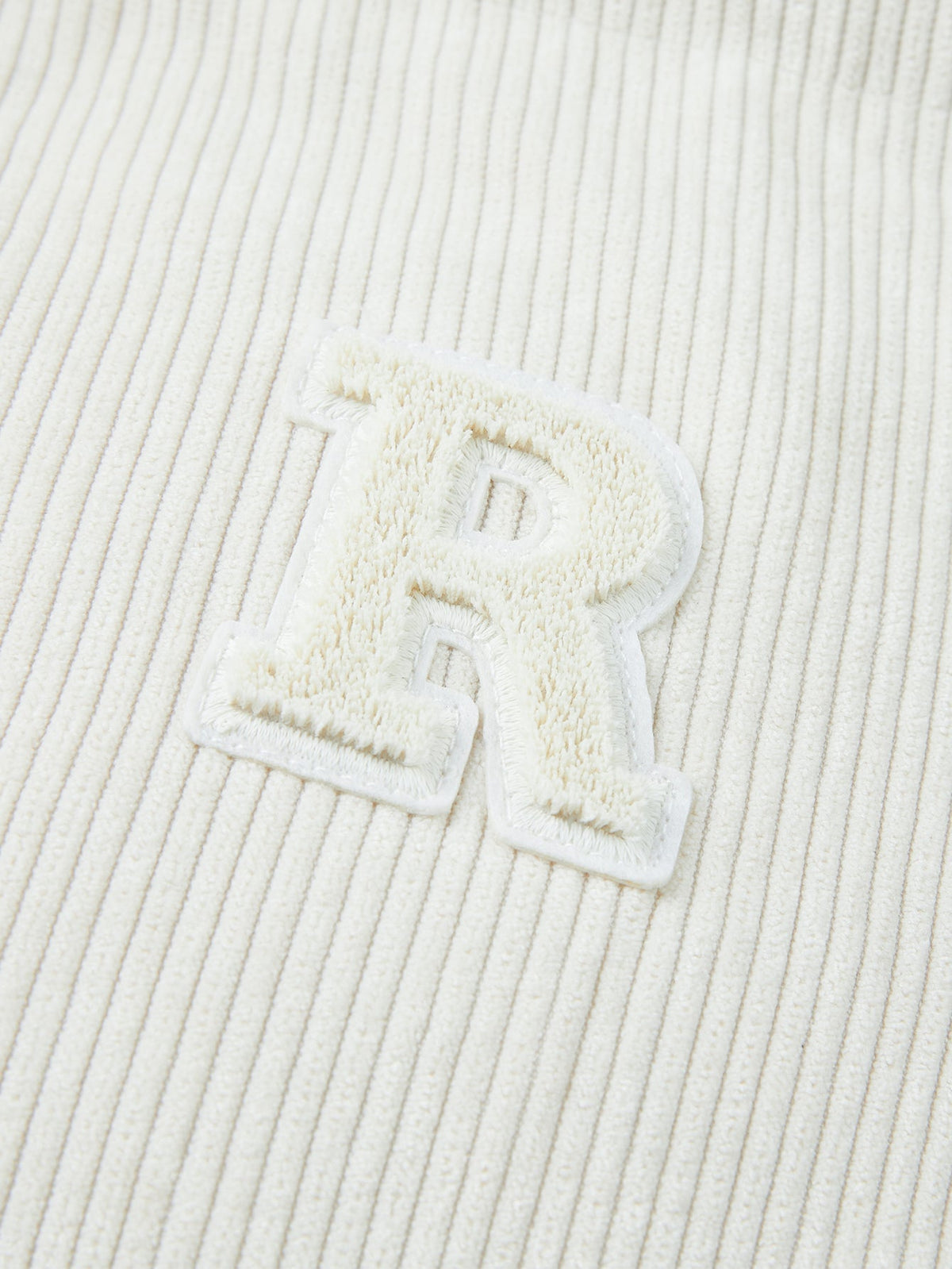 Vändbar manchesterrock med teddyfleece